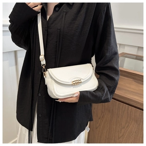 Chic white crossbody square bag for women with gold cylinder clasp on black shirt