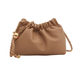 Brown leather drawstring bucket bag with gold chain strap and textured finish
