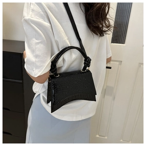 Elegant black crocodile pattern hourglass bag with knot handle and crossbody strap
