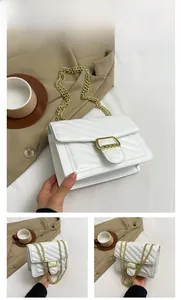 Detail view of white quilted PU leather bag with golden chain strap and buckle closure