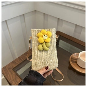 Handmade straw phone crossbody bag with a cute yellow flower charm in cream white color