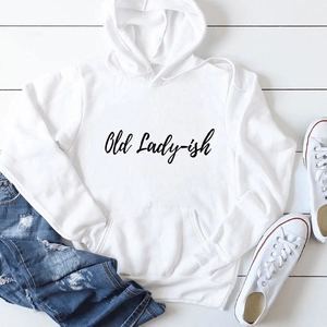 Flat lay of white hoodie with Old Lady-ish text, drawstring hood, and front pocket