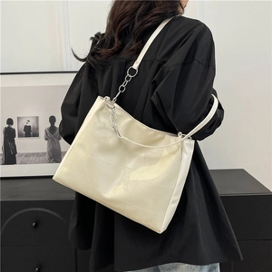 Minimalist cream white tote bag with quilted texture and metal chain strap for women