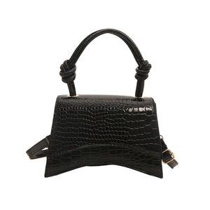 Chic black crocodile embossed handbag with curved base and knot detail handle