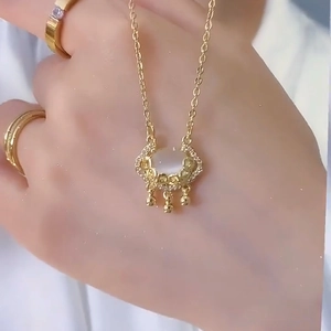 Vintage cat-eye stone Ruyi lock necklace in gold with shimmering diamond accents