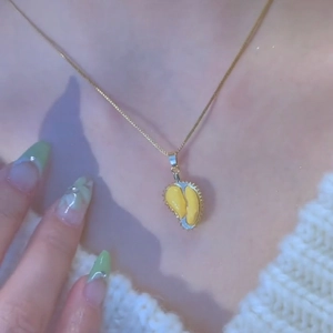 Golden durian fruit pendant necklace for women with realistic yellow fruit pulp detail
