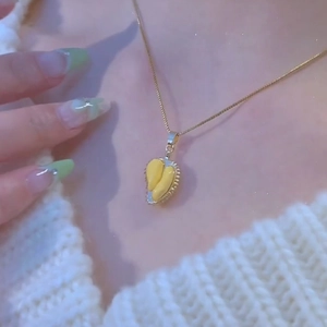 Unique gold durian fruit pendant necklace for women with realistic textured yellow flesh