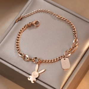 Rose gold titanium steel bracelet featuring a cute rabbit charm and dual chain design