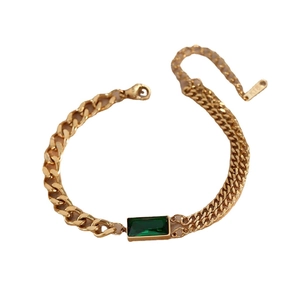 Gold titanium steel bracelet with emerald gemstone and asymmetric Cuban chain links