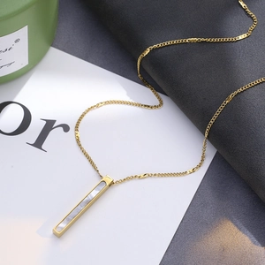 Gold rectangular bar necklace with iridescent shell inlay and twisted wavy chain link