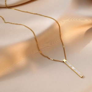 Elegant gold titanium necklace with long rectangular mother of pearl pendant on silk