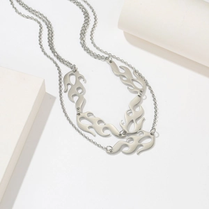 Double-layered silver titanium steel necklace featuring hollow flame pendants in Y2K style