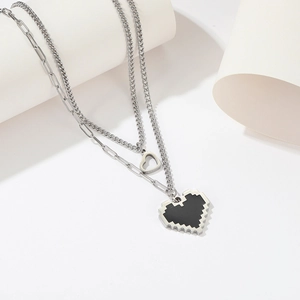 Double layered titanium steel necklace with pixel heart and cutout pendant on white background