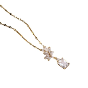 Minimalist gold titanium necklace featuring geometric zircon floral cluster pendant