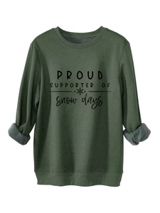 Detail of soft fleece lining inside a dark green sweatshirt with snow days print