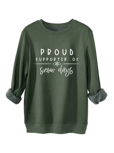 Close-up of dark green sweatshirt with fleece lining and snow days print detail