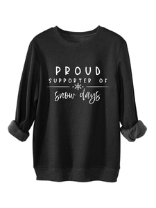 Detailed view of fleece lining on black sweatshirt with ribbed cuffs and snow print