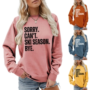 Detail of colorful ski season sweatshirts showing high-quality fabric and slogan print