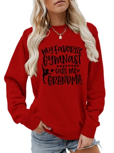 Detailed view of red cotton sweatshirt featuring black Gymnast Grandma printed typography