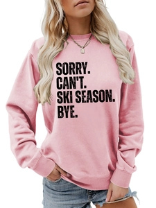 Detail of pink cotton sweatshirt featuring bold black SORRY CAN'T SKI SEASON slogan print