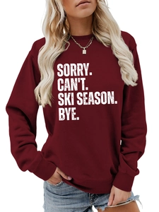 Detail of white slogan embroidery and ribbed neckline on deep wine red sweatshirt