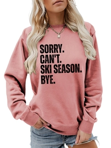 Detail of soft ribbed crewneck and black ski season letter print on dusty rose sweatshirt