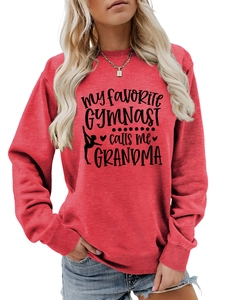 Detail of red crewneck sweatshirt featuring My Favorite Gymnast calligraphy and silhouettes