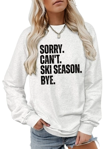 Detailed close-up of grey sweatshirt with Sorry Can't Ski Season text in bold font