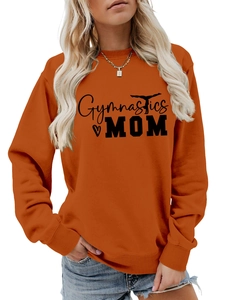 Detail of orange long sleeve gymnastics mom sweatshirt showing fabric texture and ribbing