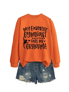 Detail of orange sweatshirt featuring My Favorite Gymnast calls me Grandma print design