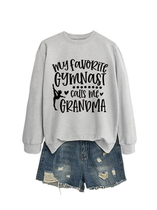 Detail of grey crewneck sweatshirt with My Favorite Gymnast print and denim shorts