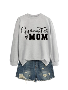 Detail of Gymnastics MOM print on grey sweatshirt with distressed denim shorts