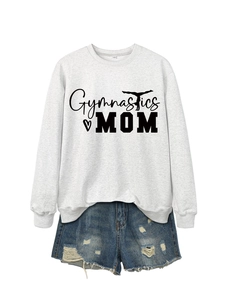 Detail view of Gymnastics MOM sweatshirt paired with vintage distressed denim shorts