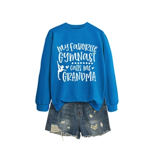 Royal blue gymnast grandma sweatshirt paired with distressed denim shorts on white background