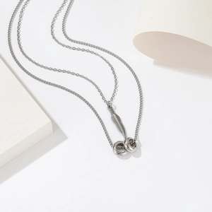 Minimalist double-layer titanium steel necklace featuring feather and double ring pendants