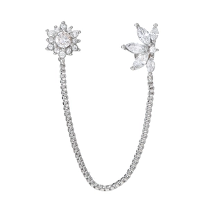 Detail of silver tassel chain earring with zircon sunflower and leaf charms