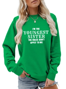 Detail of youngest sister slogan print on bright green cotton blend sweatshirt