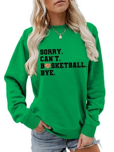Close-up of ribbed cuffs and high-quality printed basketball graphic on green sweatshirt