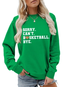 Detail of green crewneck sweatshirt featuring white basketball slogan print