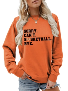 Detail of orange crewneck sweatshirt featuring SORRY CAN'T BASKETBALL BYE printed slogan