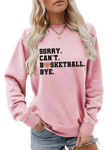 Detail of pink sweatshirt with heart basketball print and sorry can't basketball text