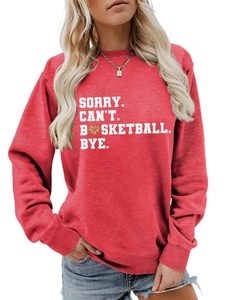 Close-up of red crewneck sweatshirt featuring white basketball letter print design