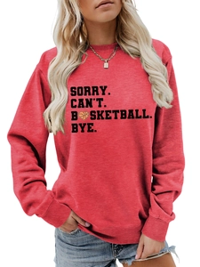 Close-up of red sweatshirt featuring black slogan print with basketball graphic