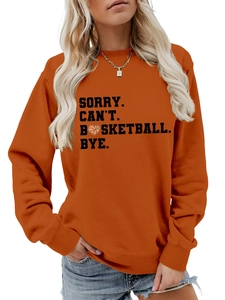 Close-up of orange crewneck sweatshirt with black basketball heart text design