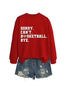 Close-up of red crewneck sweatshirt with Sorry Can't Basketball Bye text print