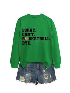 Close-up of green crewneck sweatshirt featuring SORRY CAN'T BASKETBALL BYE print design