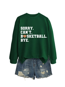 Close-up of green crewneck sweatshirt with Sorry Can't Basketball Bye heart print and denim