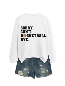 Close-up of sorry can't basketball bye text with basketball heart on white sweatshirt