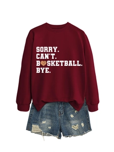 Detail of maroon crewneck sweatshirt with 'SORRY CAN'T BASKETBALL BYE' and denim shorts