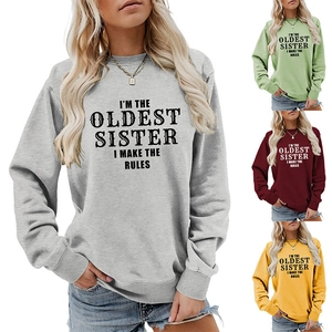 Detail view of the ribbed cuffs and high-quality letter print on this crewneck sweatshirt